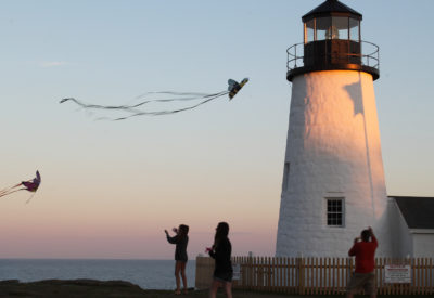 Pemaquid Point Lighthouse during sunset with kit fliers.