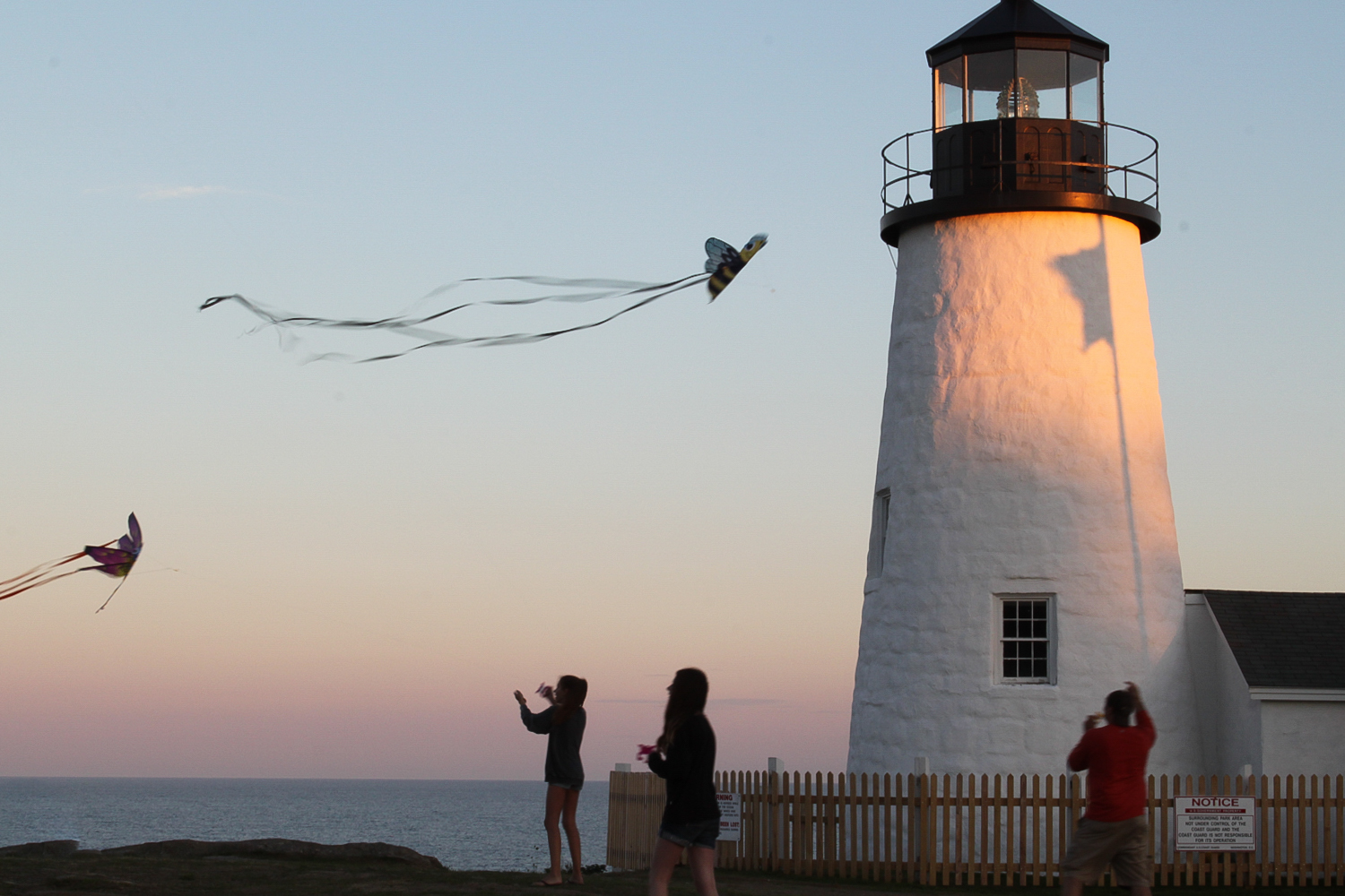Pemaquid Point Lighthouse during sunset with kit fliers.